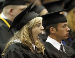 Girl yawning at graduation ceremony