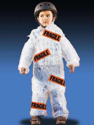 Boy wrapped in bubble wrap with Fragile stickers on him